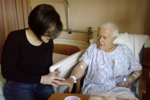 Daughter Nancy ("with the smiling face") checks out some minor swelling on her dad's hands
